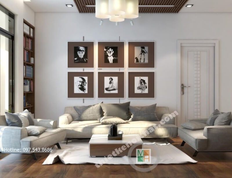 Không gian phòng khách được nâng cao hơn với sự trang trí của bộ sofa bọc vải.